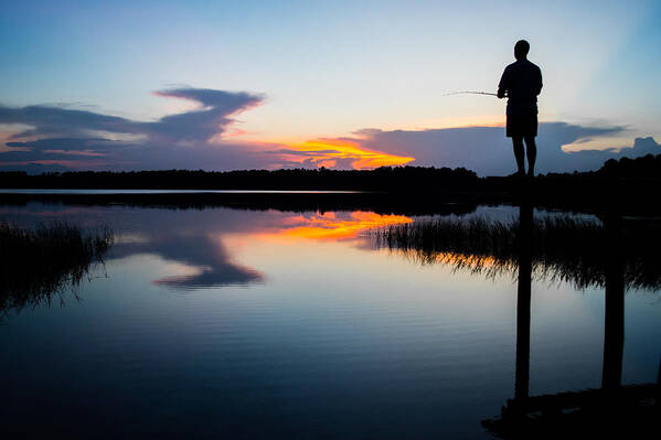 Unset Art Print featuring the photograph Fishing At Sunset by Parker Cunningham