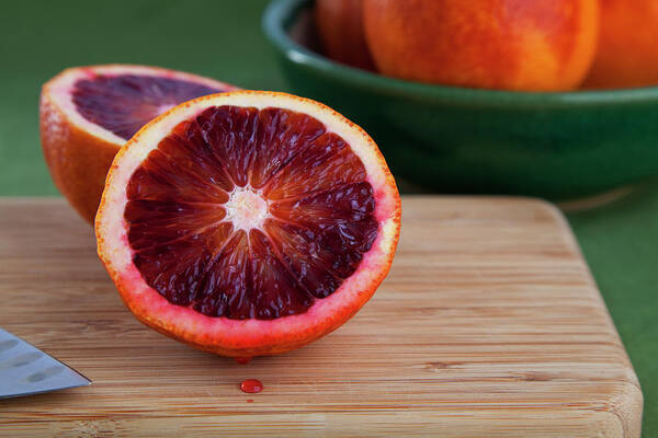 Cutting Board Art Print featuring the photograph Freshly Cut Blood Orange by Rocketroom