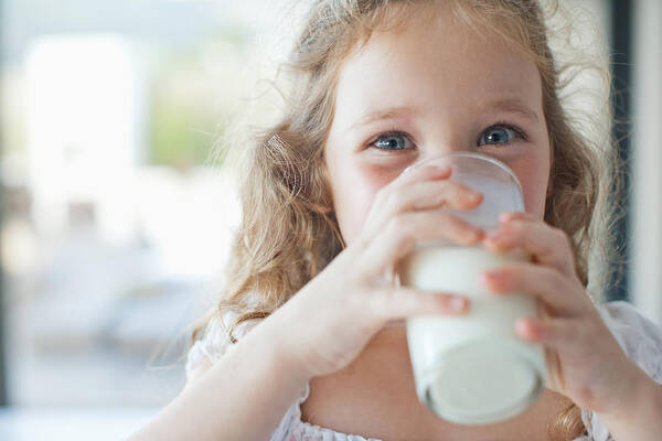 4-5 Years Art Print featuring the photograph Girl drinking glass of milk by Sam Edwards