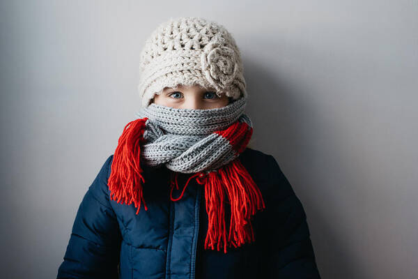 Child Art Print featuring the photograph Girl warmly wrapped up in woollen hat and scarf by Hugh Whitaker