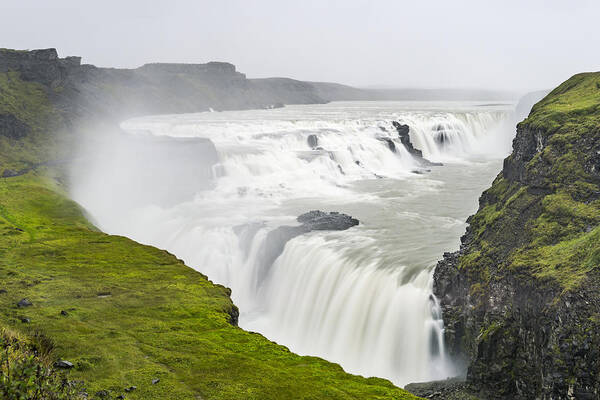 Scenics Art Print featuring the photograph Gullfoss waterfall in Iceland seen from above on a cloudy stormy day by Sjo