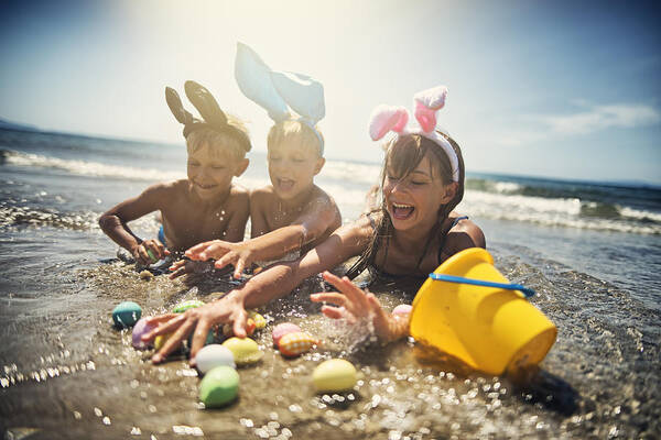 Easter Bunny Art Print featuring the photograph Kids playing in sea during summer Easter by Imgorthand