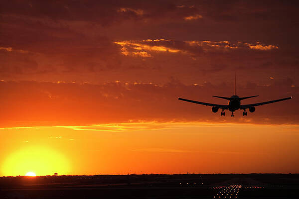 Plane Art Print featuring the photograph Landing into the Sunset by Andrew Soundarajan