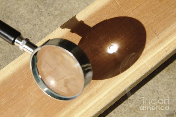 Magnifying Glass Focusing Sun Light Framed Print by GIPhotoStock - Fine Art  America