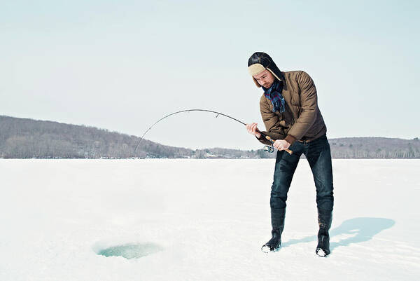 People Art Print featuring the photograph Man Ice Fishing On Frozen Lake by Andy Ryan