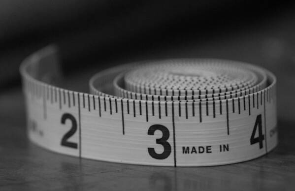 Tape Measure Art Print featuring the photograph Measuring Up by Holden The Moment