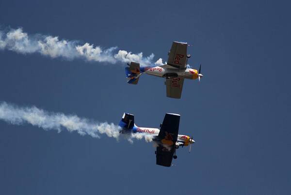 Red Bulls Aerobatics Art Print featuring the photograph Mirror Flight by Ramabhadran Thirupattur