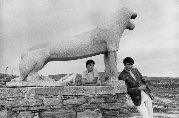 Fashion Art Print featuring the photograph Models Posing By A Sculpture Of A Lion by Leonard Nones