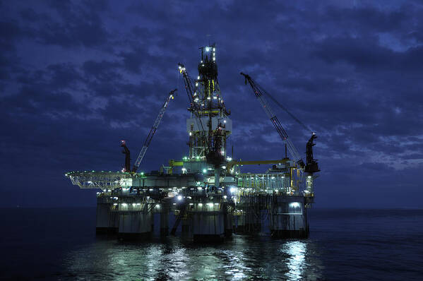 Oil Rig Art Print featuring the photograph Offshore Oil Rig At Night by Bradford Martin