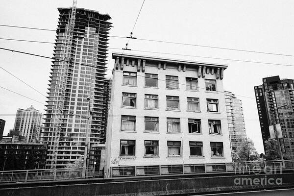 The Art Print featuring the photograph old continental hotel in front of the mark new condo project granville street yaletown Vancouver BC by Joe Fox