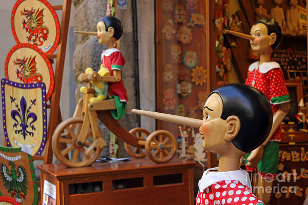 Marionette Art Print featuring the photograph Pinocchio inviting tourists in souvenirs shop by Kiril Stanchev