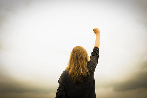 Problems Art Print featuring the photograph Revolution fist raised by Christoph Hetzmannseder