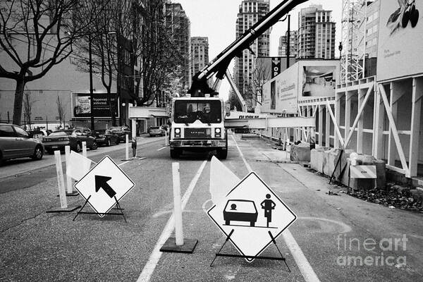 Road Art Print featuring the photograph road closed to traffic to allow large articulated crane operate at building site Vancouver BC Canada by Joe Fox