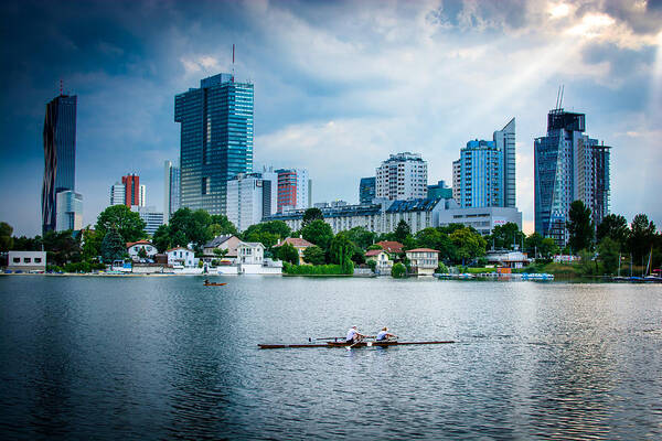 Skyline Art Print featuring the photograph Rowing Boat And The Skyline Of Vienna by Andreas Berthold