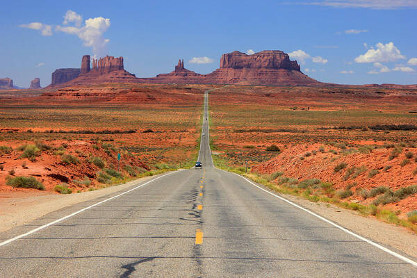 Highway 163 Art Print featuring the photograph Scenic road into Monument Valley by Wasatch Light