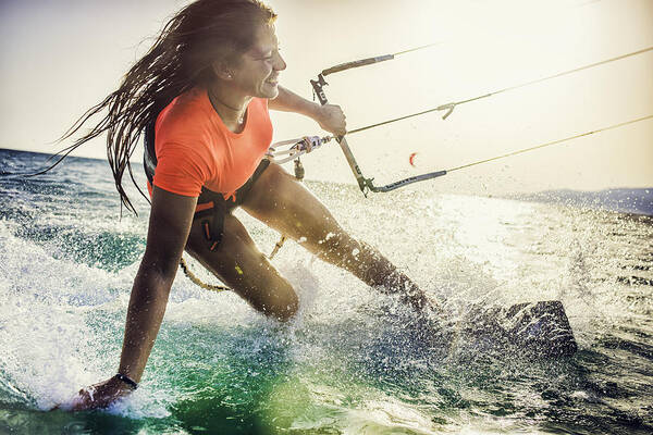 Wind Art Print featuring the photograph Smiling young female kiteboarder on the sea by Vm