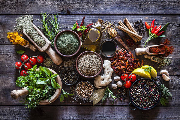 Mortar And Pestle Art Print featuring the photograph Spices and herbs on rustic wood kitchen table by Fcafotodigital