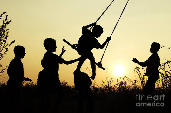 Indian Boys Art Print featuring the photograph Sunset Swing by Tim Gainey