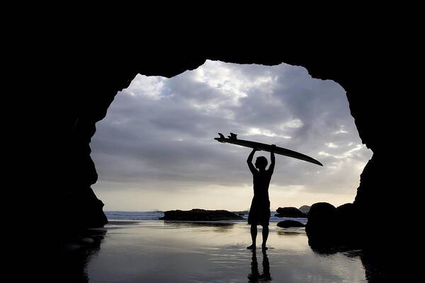 Horizon Art Print featuring the photograph Surfer Inside A Cave At Muriwai North by Deddeda