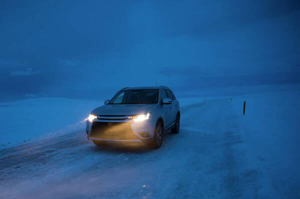 Rim Road Art Print featuring the photograph Suv Driving On Snowy Icy Road by Brandon Huttenlocher