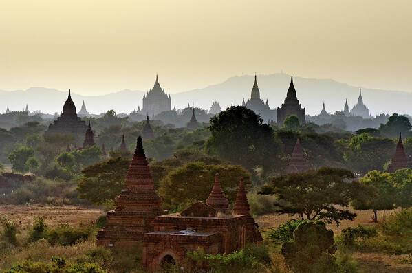 Tranquility Art Print featuring the photograph Temples In Distant Haze At Sunset by Rwp Uk