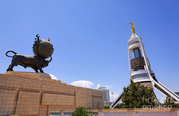 Turkmenistan Art Print featuring the photograph The Earthquake memorial statue and the Arch of Neutrality in Ashgabat Turkmenistan by Robert Preston