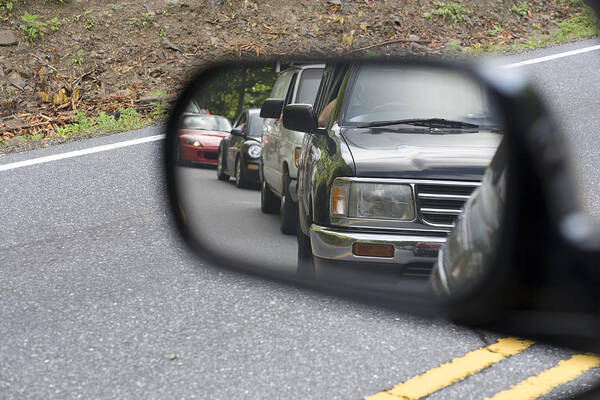 Following Art Print featuring the photograph Traffic in the rear view mirror by Wbritten