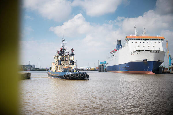 Freight Transportation Art Print featuring the photograph Tugboat Approaching Ferry In Harbour by Monty Rakusen