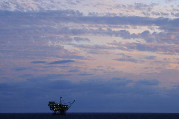 Oil Rig Art Print featuring the photograph Twilight sky and oil rig by Bradford Martin