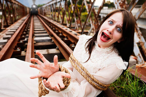 Three Quarter Length Art Print featuring the photograph Victorian maiden tied to train tracks screams as engine approaches by RapidEye