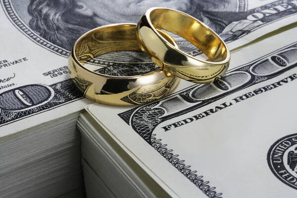 Yellow Art Print featuring the photograph Wedding rings and stack of money by Ayala_studio