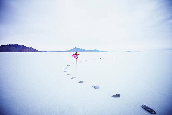 Scenics Art Print featuring the photograph Woman On Stone Pathway In Lake With by Thomas Barwick