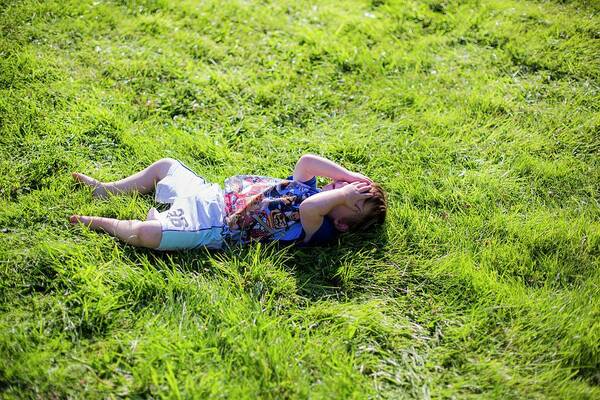 Photography Art Print featuring the photograph Young Boy Lying On Grass by Samuel Ashfield