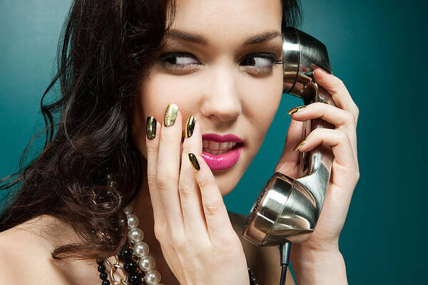 People Art Print featuring the photograph Young woman using vintage telephone by Image Source