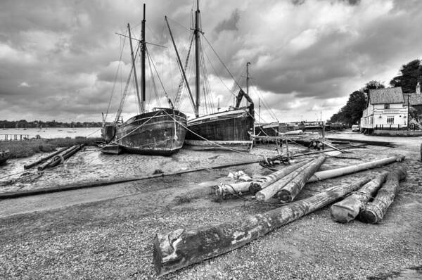 Butt And Oyster Art Print featuring the photograph Boats and logs at Pin Mill #2 by Gary Eason