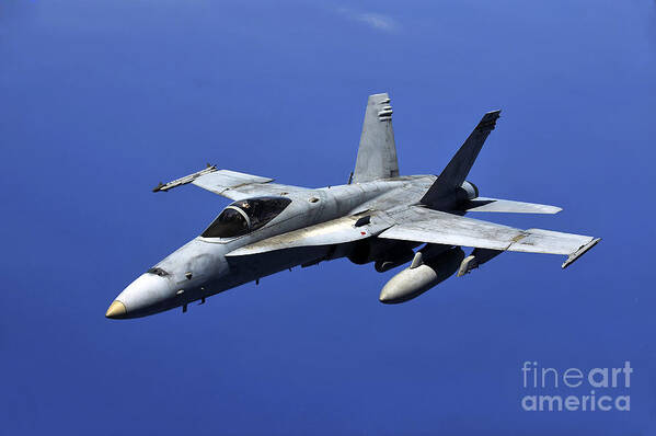 Rimpac Art Print featuring the photograph A Fa-18 Hornet Flies A Mission by Stocktrek Images