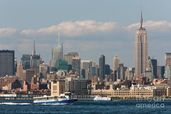 Clarence Holmes Art Print featuring the photograph Manhattan Skyline and Ferry Traffic by Clarence Holmes