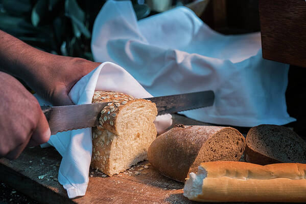 Bread Art Print featuring the photograph Bread Separate By Knife And Hand #1 by Anek Suwannaphoom