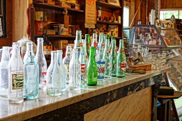Bottles Art Print featuring the photograph At the Store by Steven Clipperton