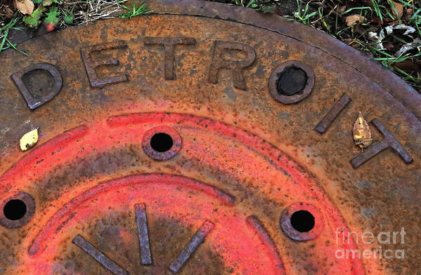 Detroit Manhole Cover Art Print featuring the photograph Detroit manhole cover spray painter red by Sandra Church