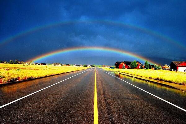 Rainbow Art Print featuring the photograph Double Rainbow over a Road by Matt Quest