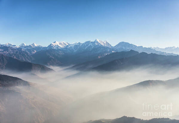 Everest Base Camp Art Print featuring the photograph Flying above the clouds in the Himalayas in Nepal by Didier Marti