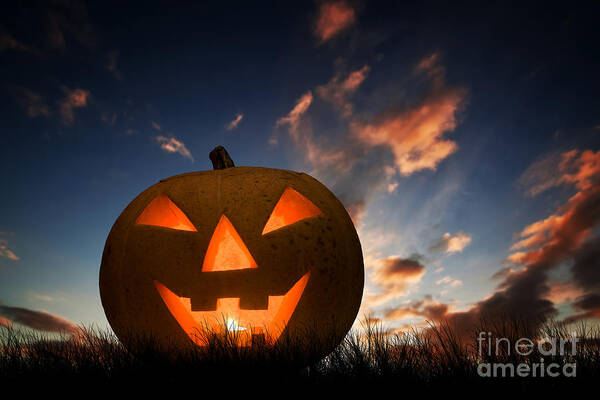 Halloween Art Print featuring the photograph Halloween pumpkin glowing under dark sunset, night sky. Jack o'lantern by Michal Bednarek