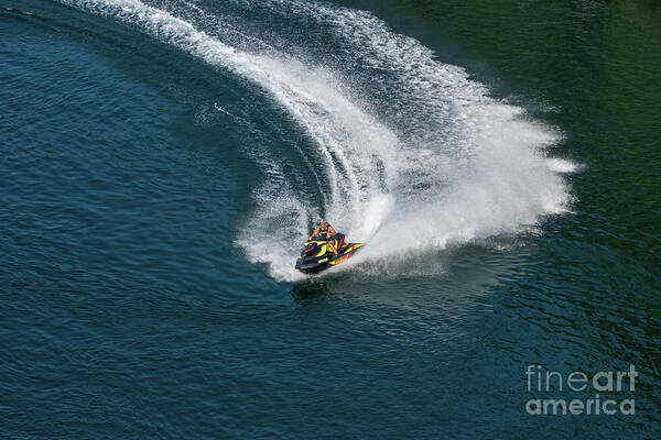 Jet Art Print featuring the photograph Jet ski on a dark blue water by Les Palenik