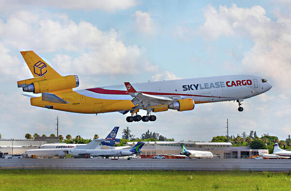 Md-11 Art Print featuring the photograph MD-11 Lands at MIA by Dart Humeston