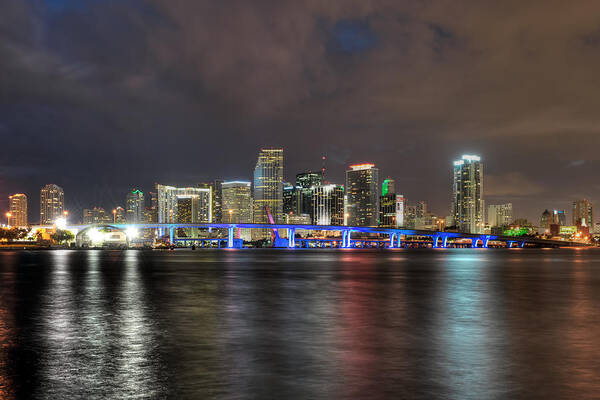 The Miami Skyline At Night. This Photograph Was Taken From Watson Island Across From The Miami Children's Museum. Art Print featuring the photograph Miami Skyline at Night by Mark Whitt