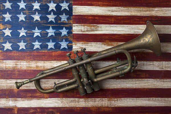 Old Trumpet Art Print featuring the photograph Old trumpet on American flag by Garry Gay