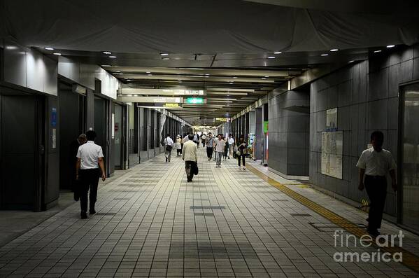 Tokyo Art Print featuring the photograph Pedestrians walk through underground tunnel at Shinjuku station Tokyo Japan by Imran Ahmed