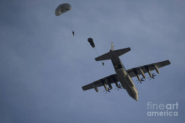 Exercise Emerald Warrior Art Print featuring the photograph Personnel Jump From A C-130 Hercules by Stocktrek Images