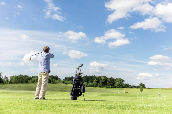 Golf Art Print featuring the photograph Senior fit man hitting a golf ball. by Michal Bednarek